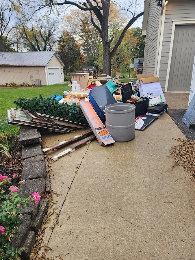 Dumpster being loaded with debris for 10 Yard Dumpster Rental in Bladensburg